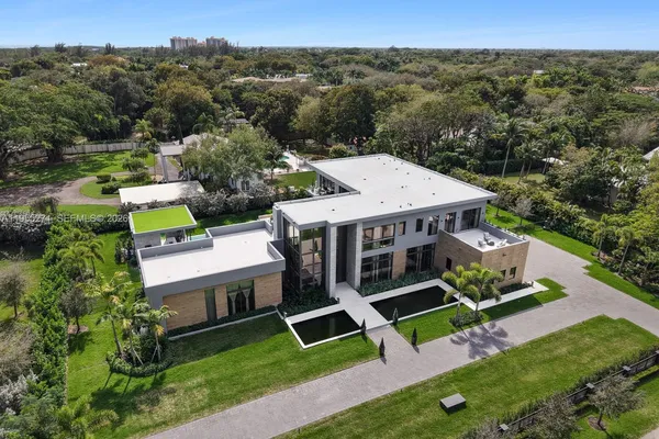an aerial view of a house with a garden