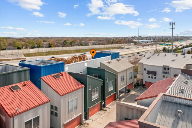 a view of city from balcony having outdoor seating