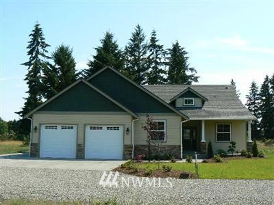 9049 176th Avenue Southwest Rochester, WA 98579 - Photo 1 of 1 a front view of a house with a yard and garage