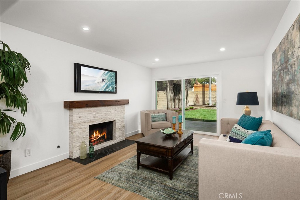 2221 Apple Tree Drive Tustin, CA 92780 - Photo 14 of 30 a living room with furniture and a fireplace