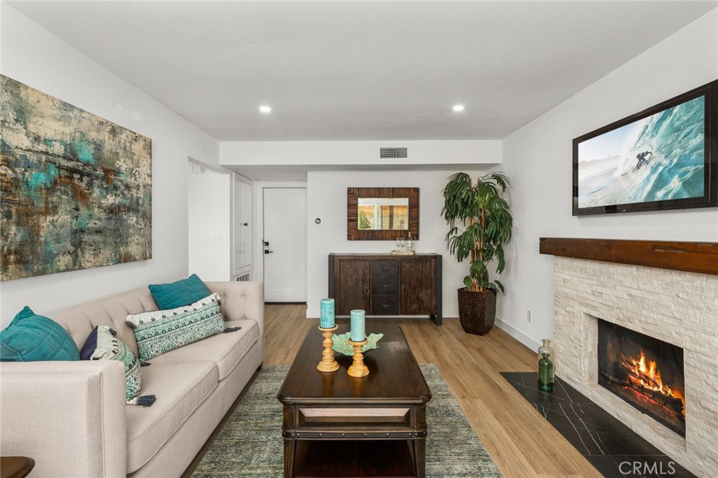 2221 Apple Tree Drive Tustin, CA 92780 - Photo 15 of 30 a living room with furniture and a fireplace