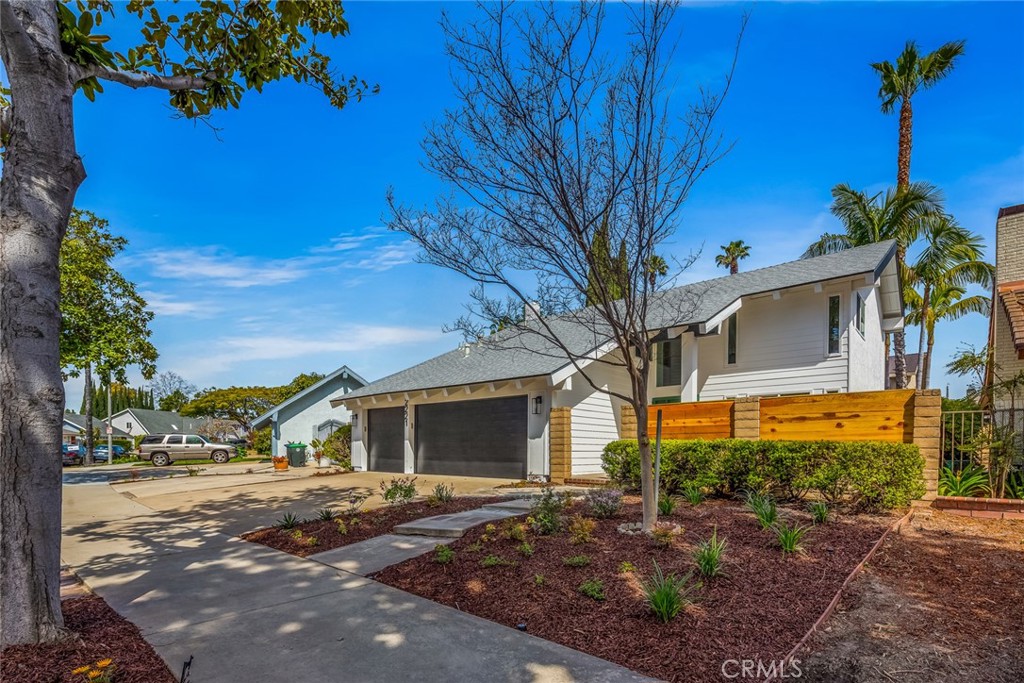 2221 Apple Tree Drive Tustin, CA 92780 - Photo 2 of 30 a front view of a house with garden