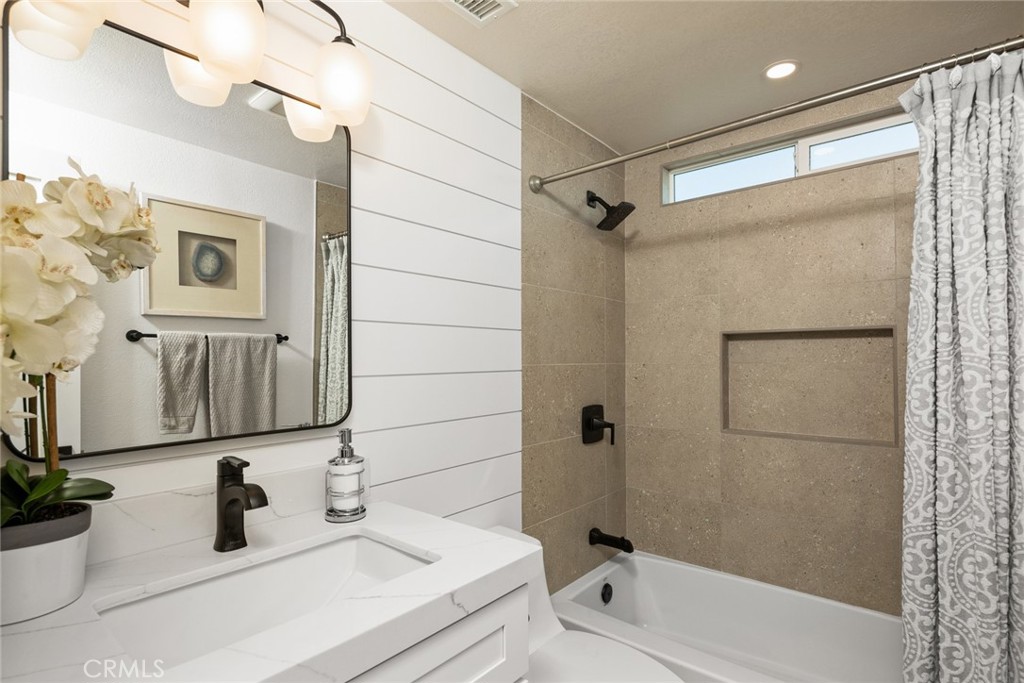 2221 Apple Tree Drive Tustin, CA 92780 - Photo 22 of 30 a bathroom with a sink and a mirror