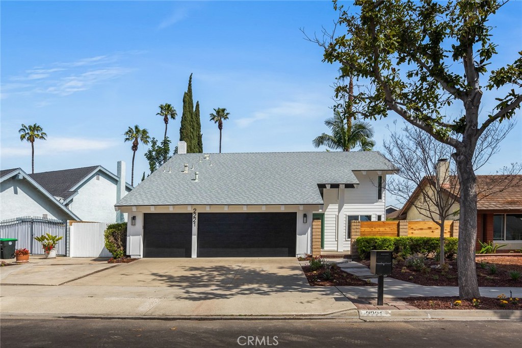 2221 Apple Tree Drive Tustin, CA 92780 - Photo 3 of 30 a front view of a house with a garage