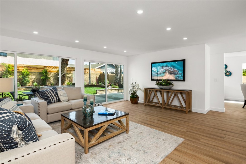 2221 Apple Tree Drive Tustin, CA 92780 - Photo 9 of 30 a living room with furniture and a flat screen tv