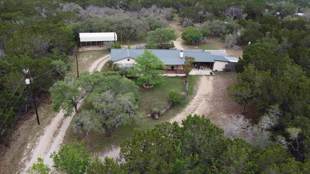 an aerial view of a house with outdoor space
