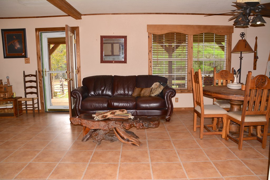 341 Seth Circle Bandera, TX 78003 - Photo 11 of 28 a living room with furniture and a large window