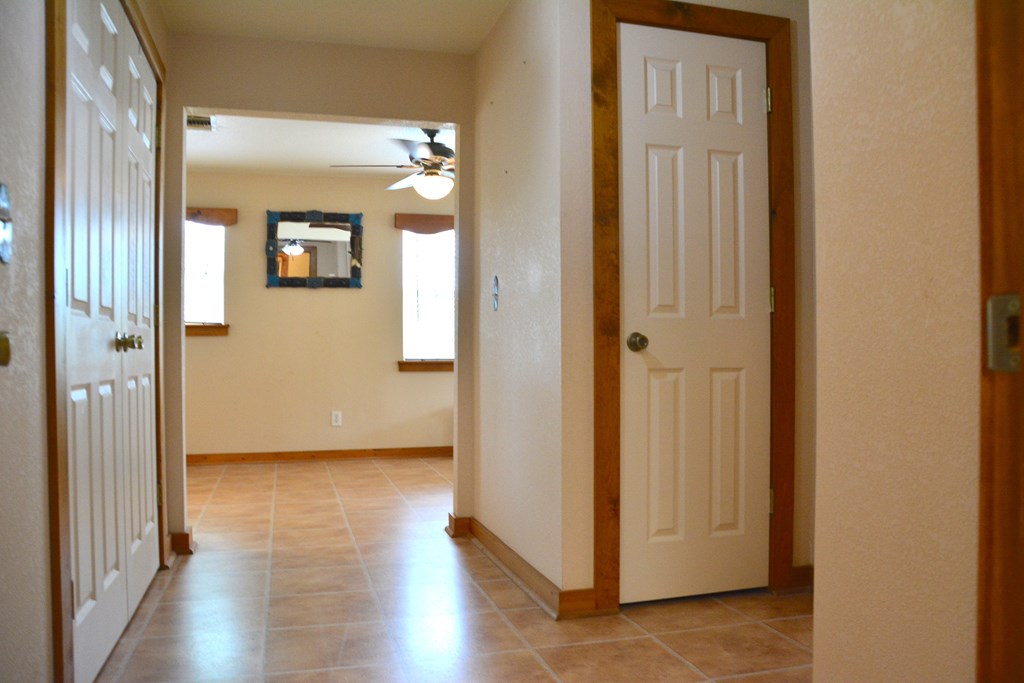 341 Seth Circle Bandera, TX 78003 - Photo 16 of 28 a view of a hallway with wooden floor