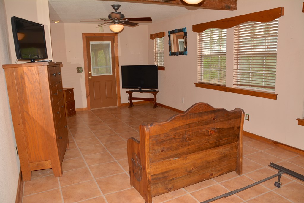341 Seth Circle Bandera, TX 78003 - Photo 18 of 28 a living room with furniture and a flat screen tv