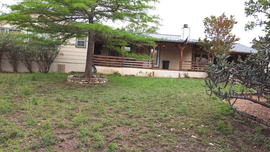 341 Seth Circle Bandera, TX 78003 - Photo 2 of 28 a front view of a house with a yard