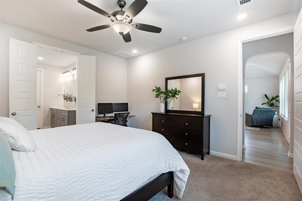 2012 Pacific Avenue Anna, TX 75409 - Photo 18 of 34 a large bedroom with a bed and a chandelier
