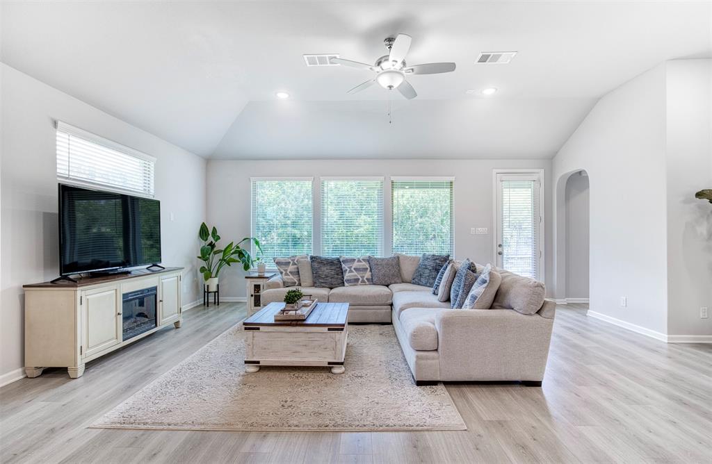 2012 Pacific Avenue Anna, TX 75409 - Photo 2 of 34 a living room with furniture and a flat screen tv