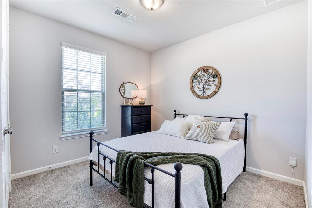2012 Pacific Avenue Anna, TX 75409 - Photo 21 of 34 a bedroom with a bed and a window