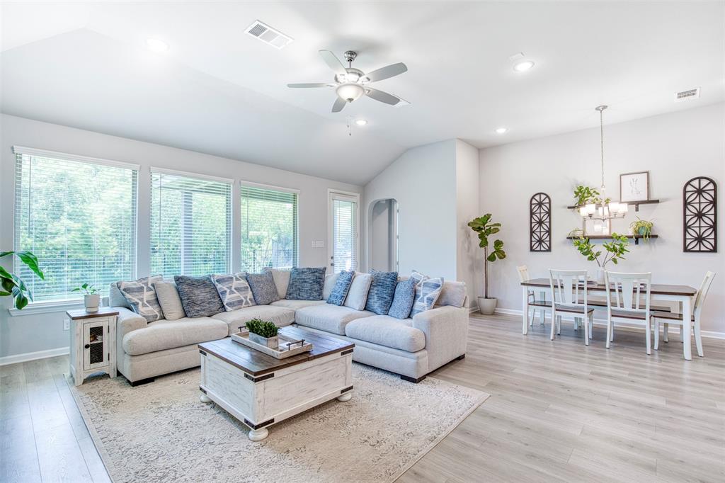 2012 Pacific Avenue Anna, TX 75409 - Photo 3 of 34 a living room with furniture ceiling fan and a large window