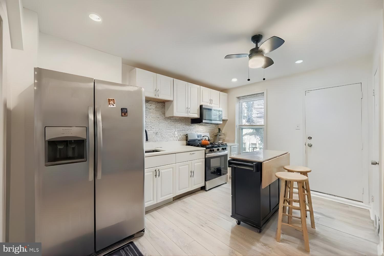 904 North Franklintown Road Baltimore, MD 21216 - Photo 5 of 26 Stainless steel appliances and updated cabinets
