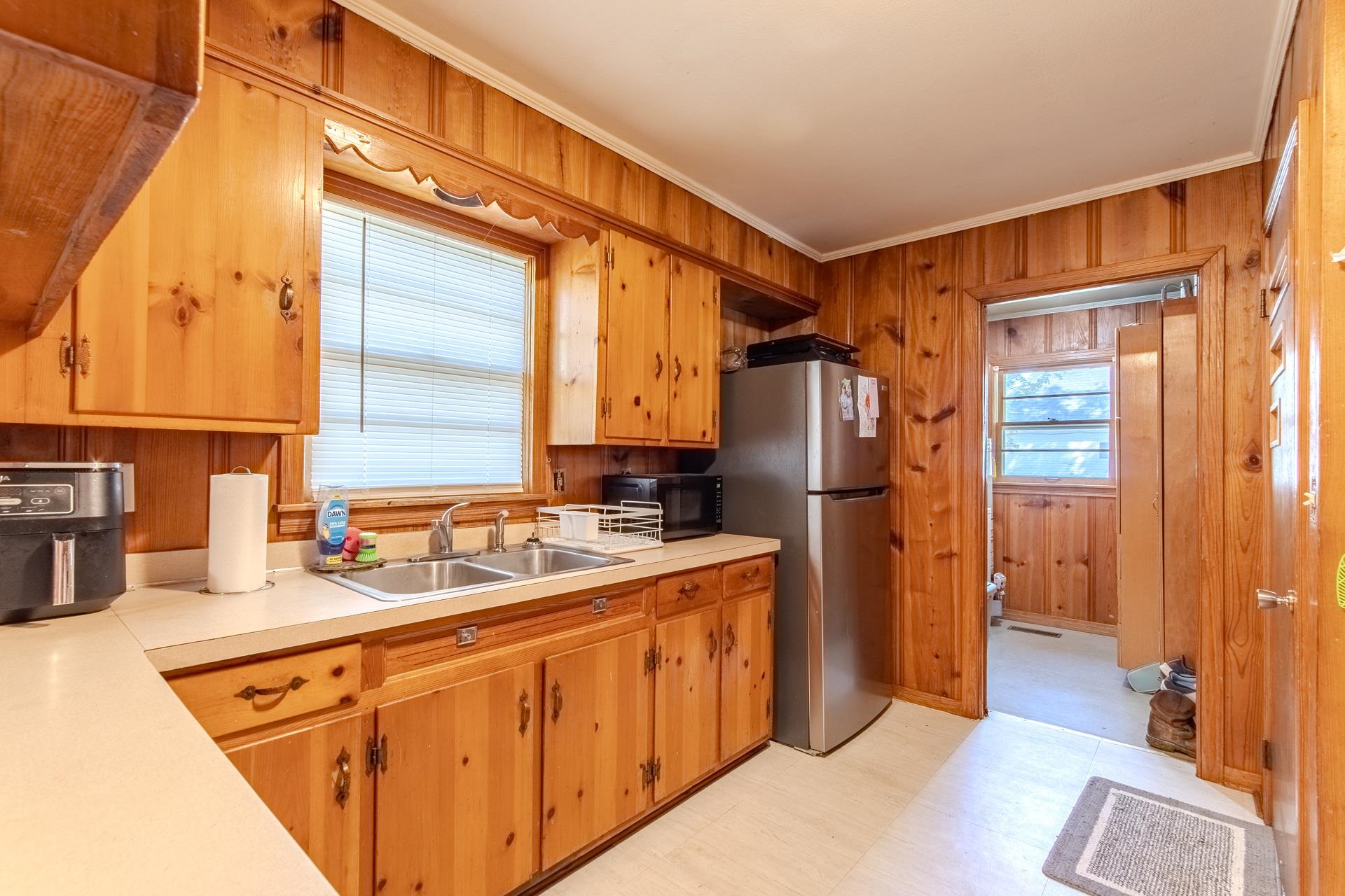 615 Patterson Road Savannah, TN 38372 - Photo 14 of 38 a kitchen with a refrigerator and a sink