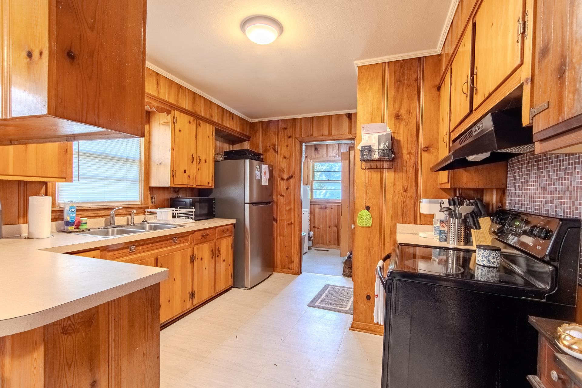 615 Patterson Road Savannah, TN 38372 - Photo 15 of 38 a kitchen with stainless steel appliances granite countertop a sink a stove and a refrigerator