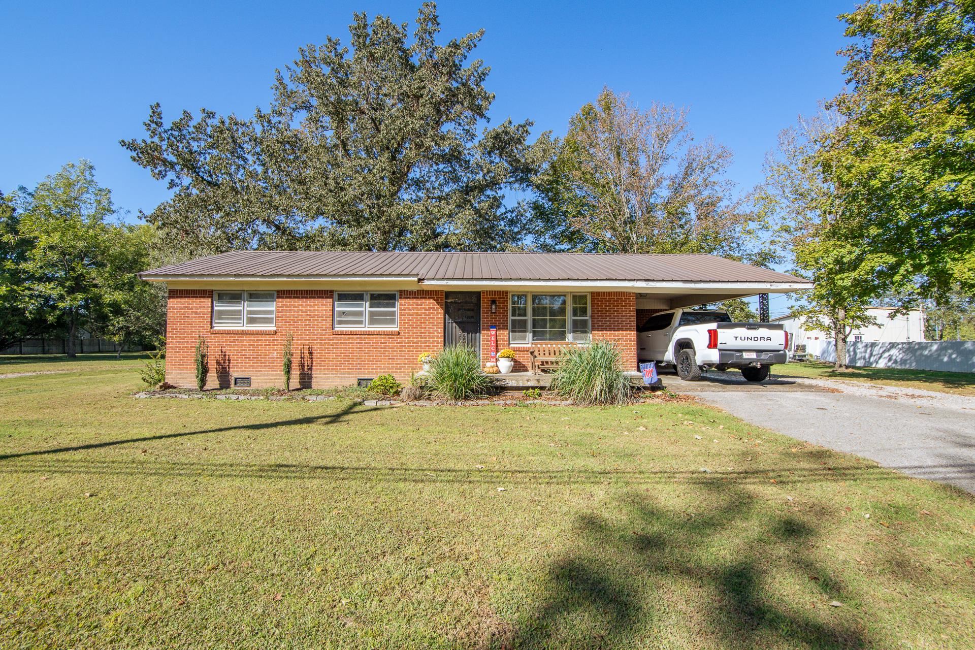 615 Patterson Road Savannah, TN 38372 - Photo 25 of 38 a front view of a house with garden