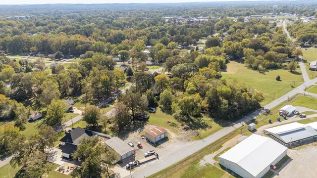 a aerial view of a house with a yard