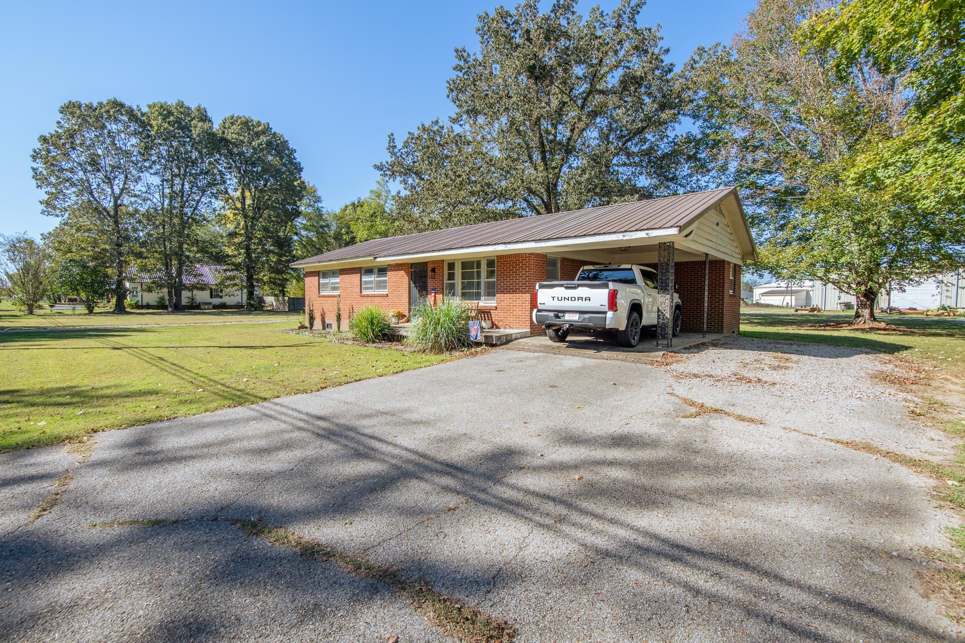 615 Patterson Road Savannah, TN 38372 - Photo 37 of 38 a car parked in front of a house
