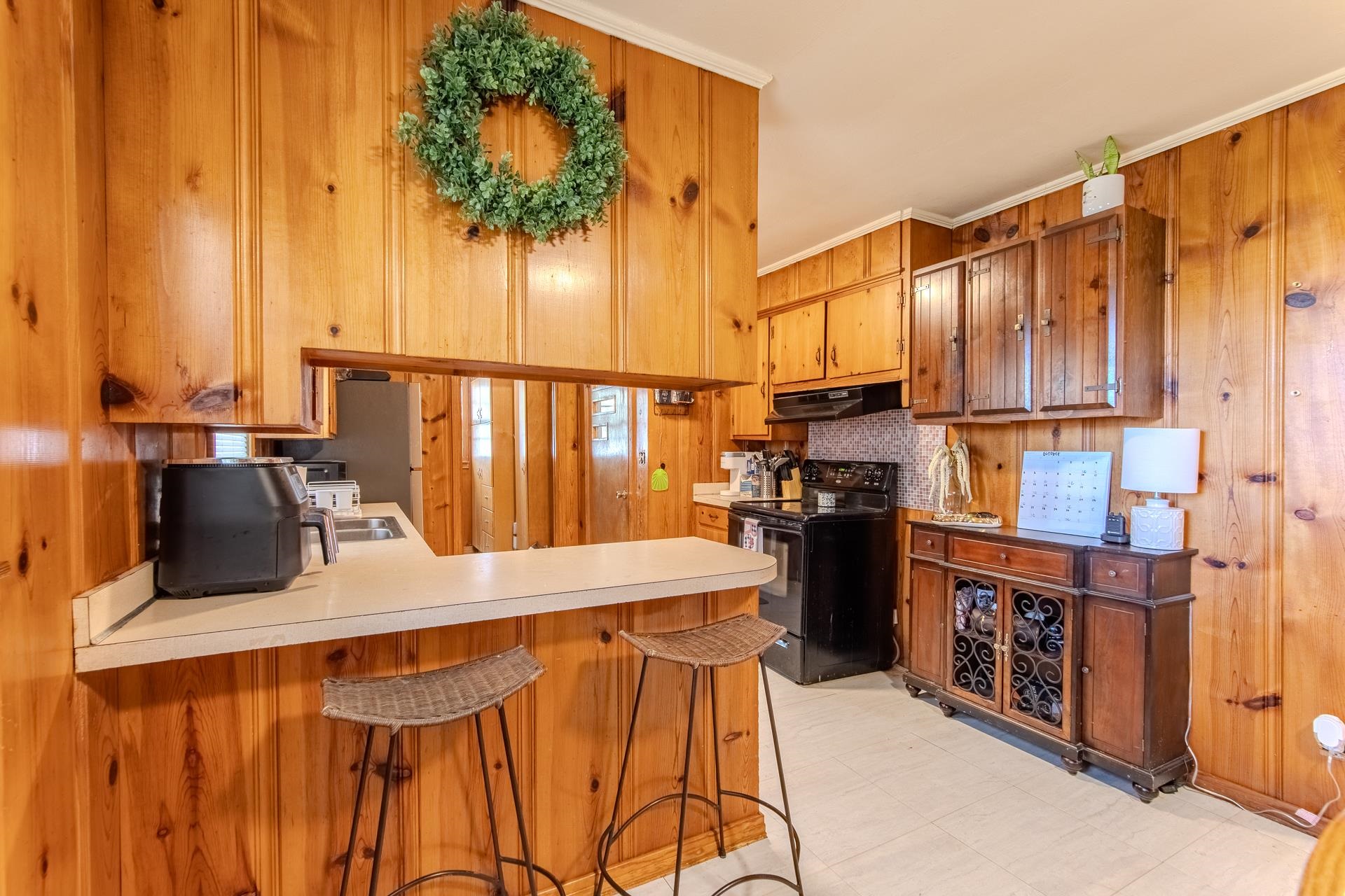 615 Patterson Road Savannah, TN 38372 - Photo 9 of 38 a kitchen with stainless steel appliances kitchen island granite countertop a table chairs in it