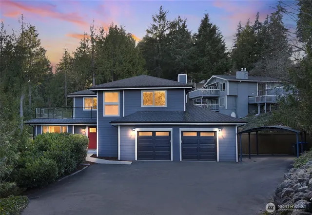 a living room with furniture large window and wooden floor