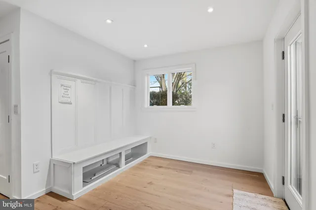 a view of room with window and wooden floor