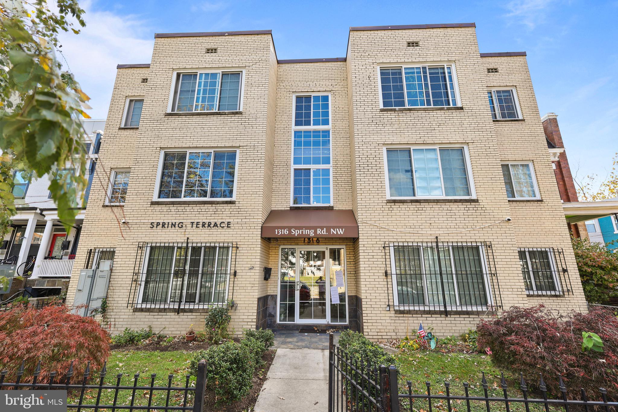 1316 Spring Road Northwest, Unit 102 Washington, DC 20010 - Photo 2 of 11 front view of a brick building