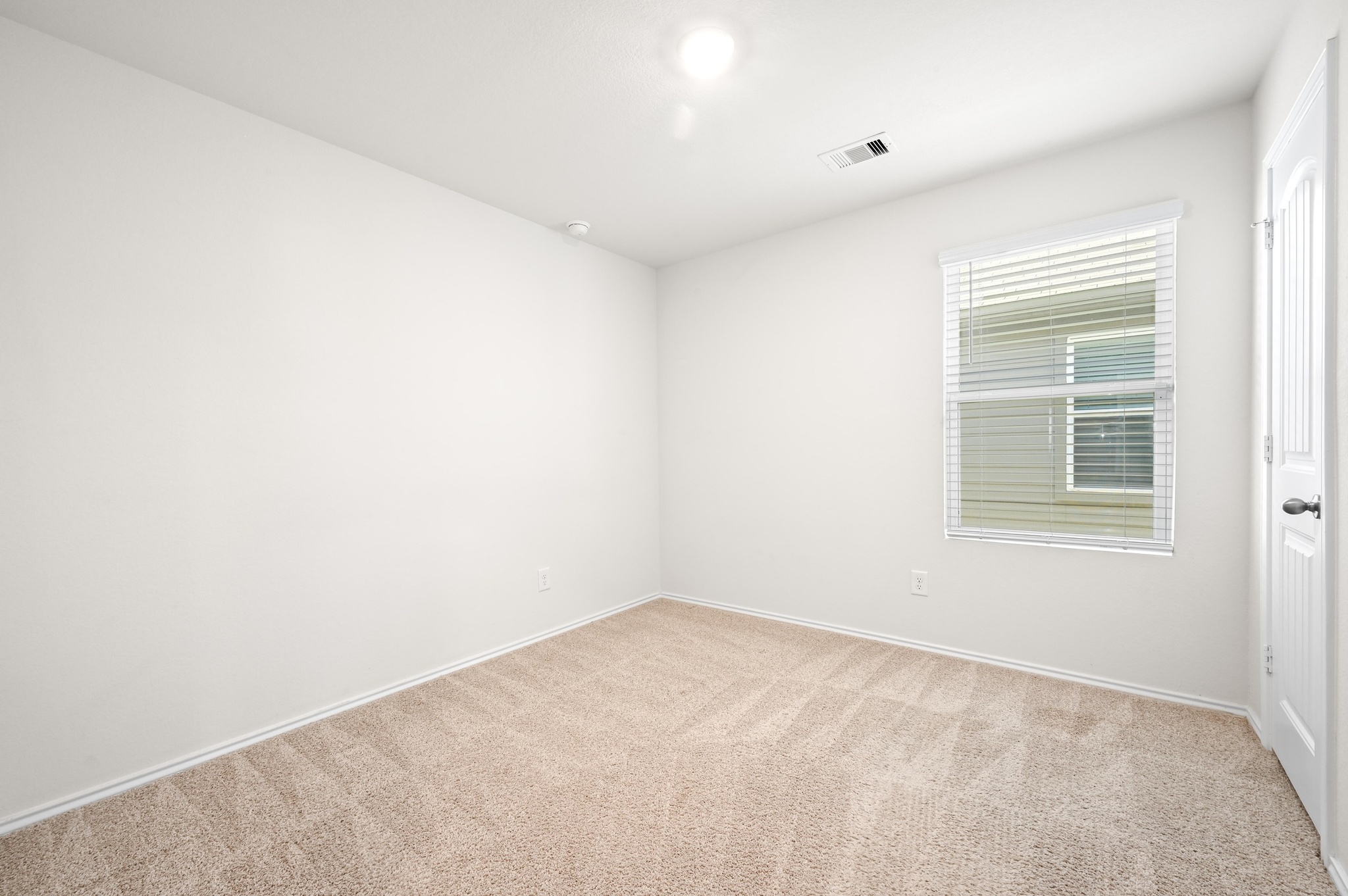 412 Sickle Loop Kyle, TX 78640 - Photo 19 of 25 Empty room featuring light colored carpet and baseboards