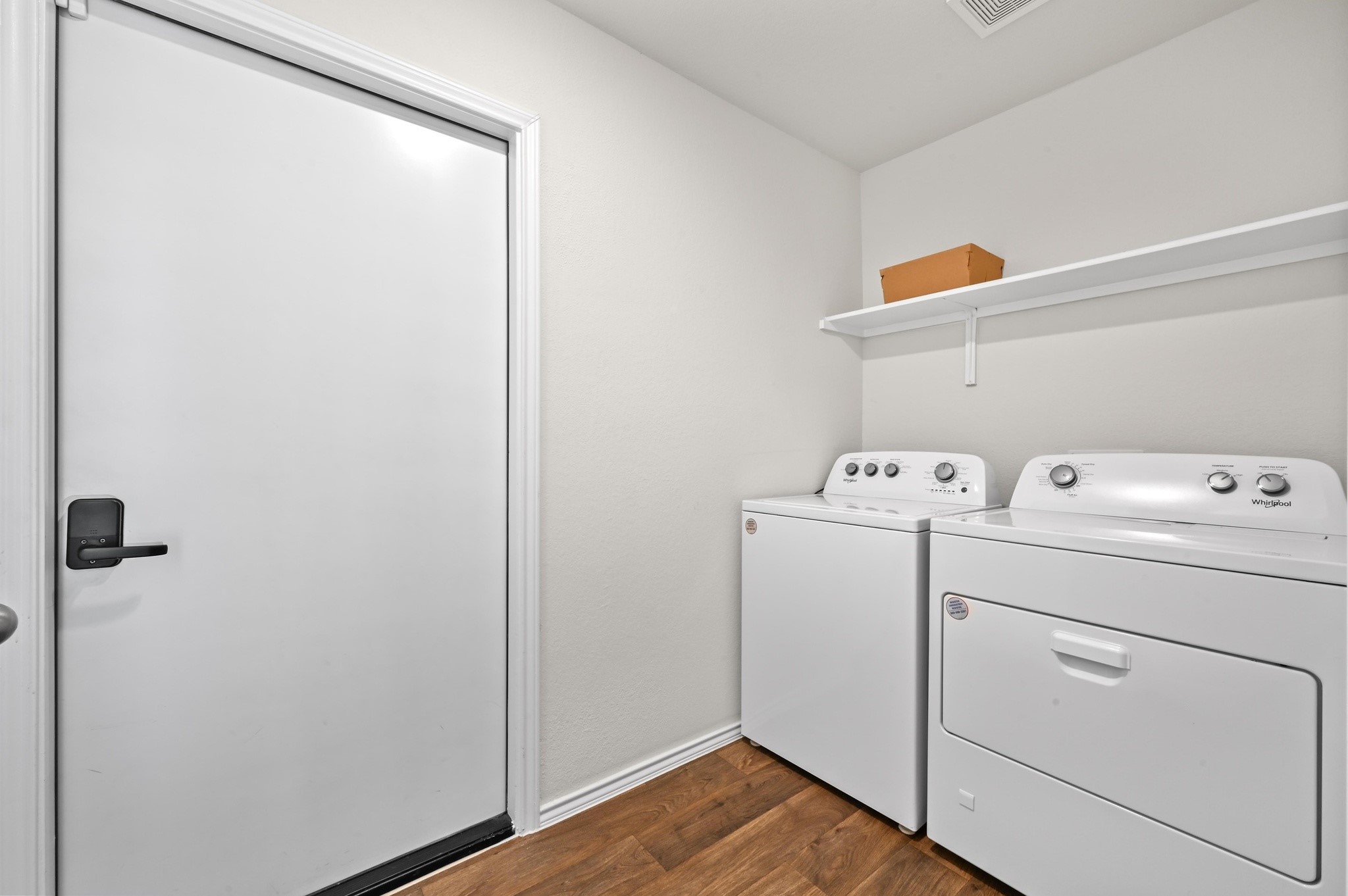412 Sickle Loop Kyle, TX 78640 - Photo 21 of 25 Laundry area featuring dark wood-type flooring and independent washer and dryer