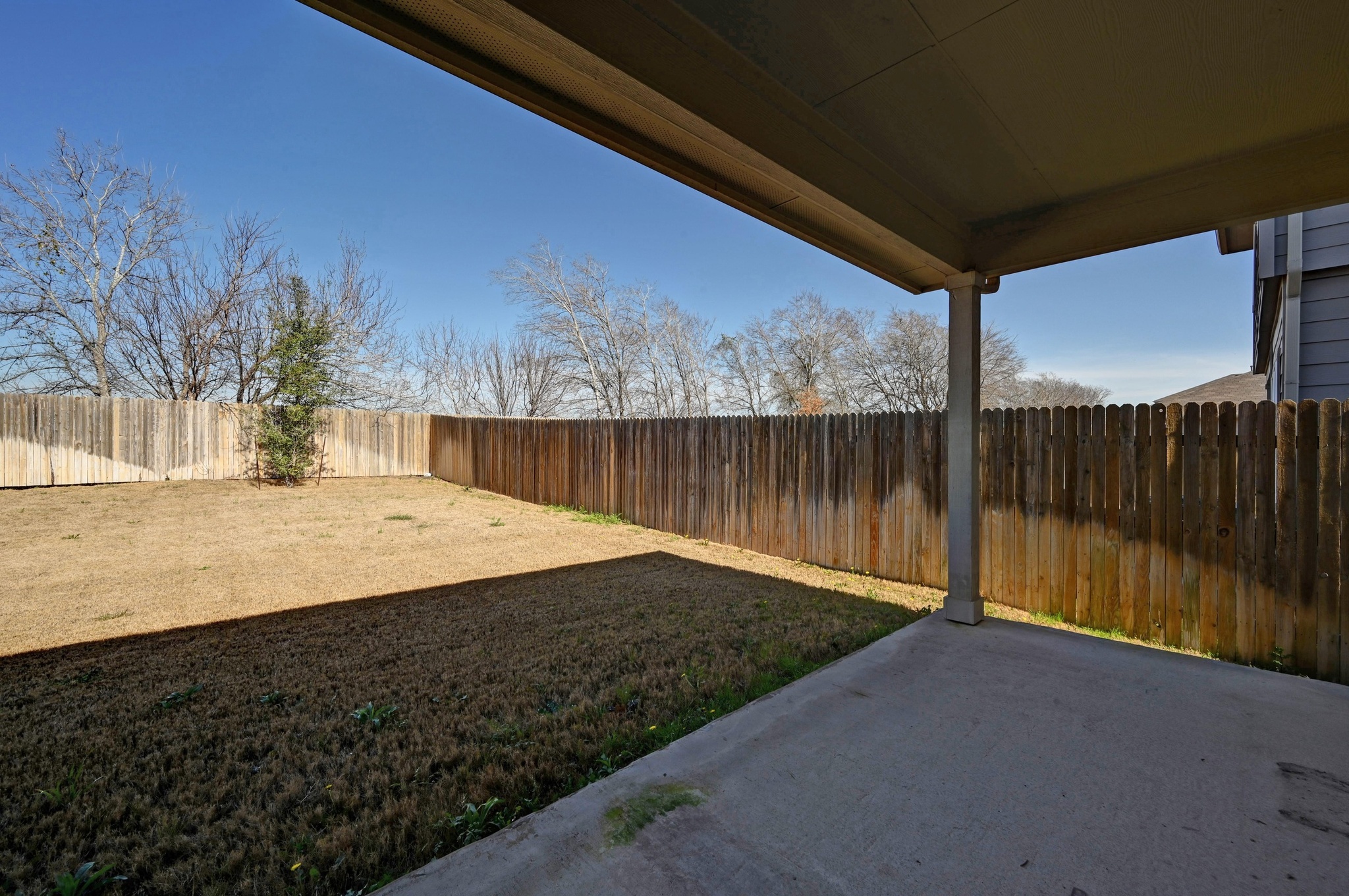 412 Sickle Loop Kyle, TX 78640 - Photo 22 of 25 Fenced backyard with a patio area