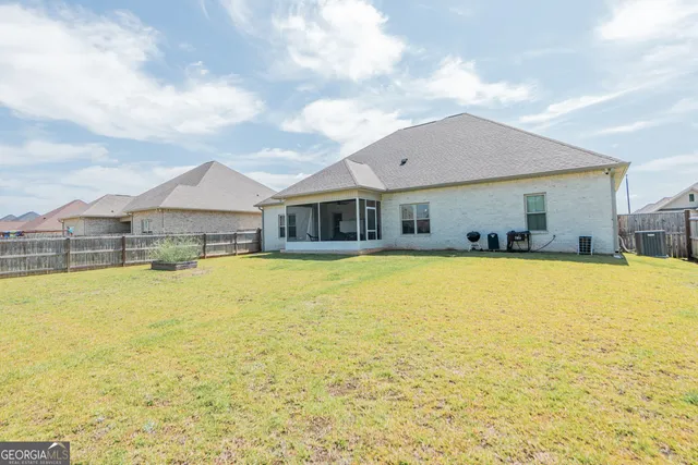 a front view of house swimming pool with seating area