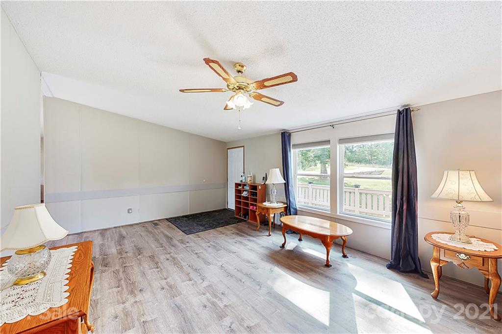 2688 Howells Ferry Road Hickory Grove, SC 29717 - Photo 11 of 43 a living room with furniture and a floor to ceiling window