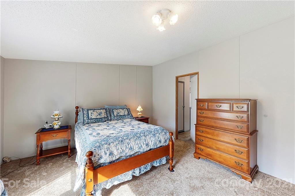 2688 Howells Ferry Road Hickory Grove, SC 29717 - Photo 16 of 43 a bedroom with a bed and a dresser