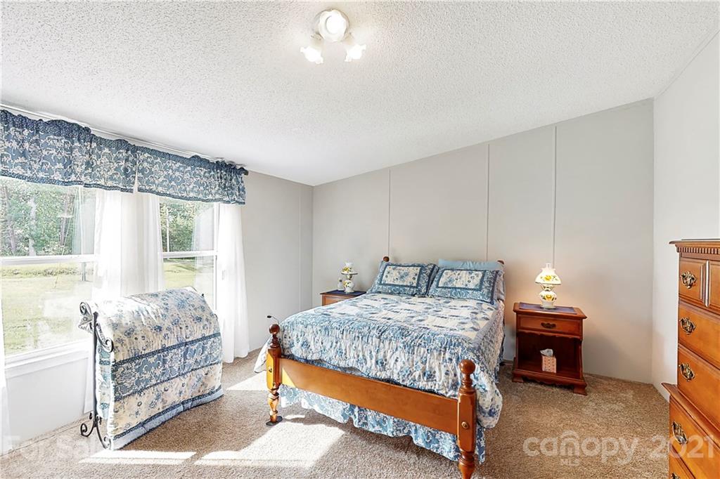2688 Howells Ferry Road Hickory Grove, SC 29717 - Photo 18 of 43 a bedroom with a bed and a window