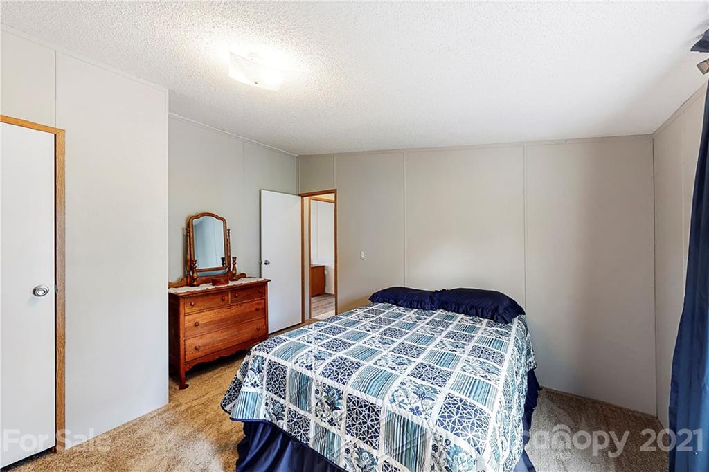 2688 Howells Ferry Road Hickory Grove, SC 29717 - Photo 23 of 43 a bedroom with a bed and a dresser