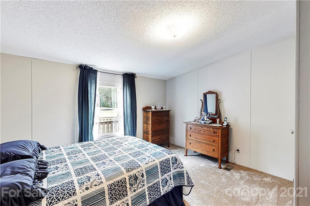 2688 Howells Ferry Road Hickory Grove, SC 29717 - Photo 25 of 43 a bedroom with a bed and a chair