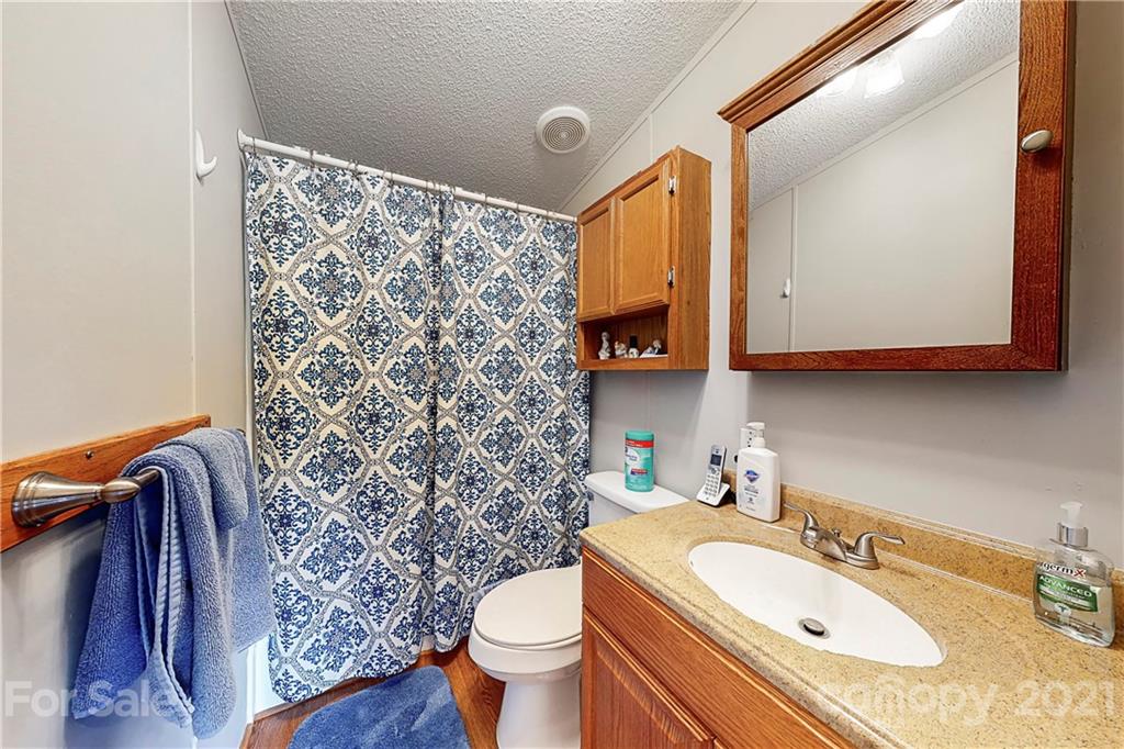 2688 Howells Ferry Road Hickory Grove, SC 29717 - Photo 26 of 43 a bathroom with a sink toilet and shower