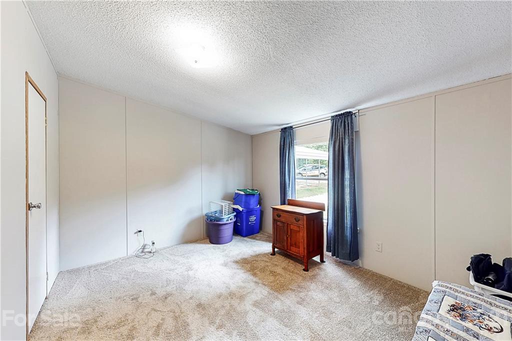 2688 Howells Ferry Road Hickory Grove, SC 29717 - Photo 27 of 43 a view of a bedroom with a bed and a window