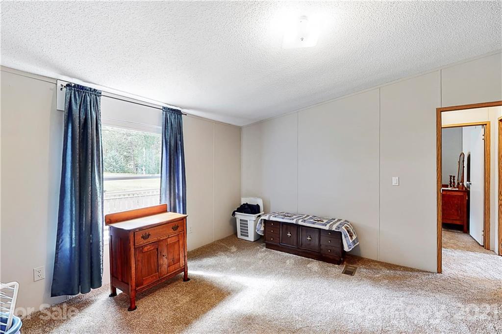 2688 Howells Ferry Road Hickory Grove, SC 29717 - Photo 29 of 43 a room with furniture and a window