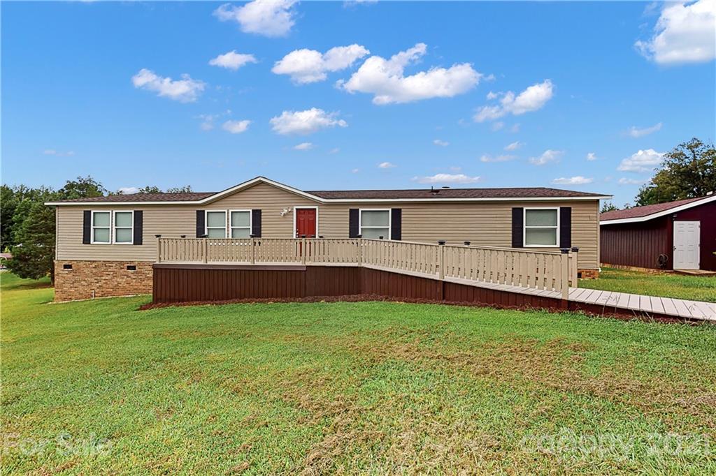 2688 Howells Ferry Road Hickory Grove, SC 29717 - Photo 32 of 43 a view of a house with a yard and deck