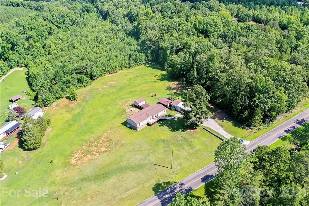 2688 Howells Ferry Road Hickory Grove, SC 29717 - Photo 37 of 43 a view of a swimming pool with a yard