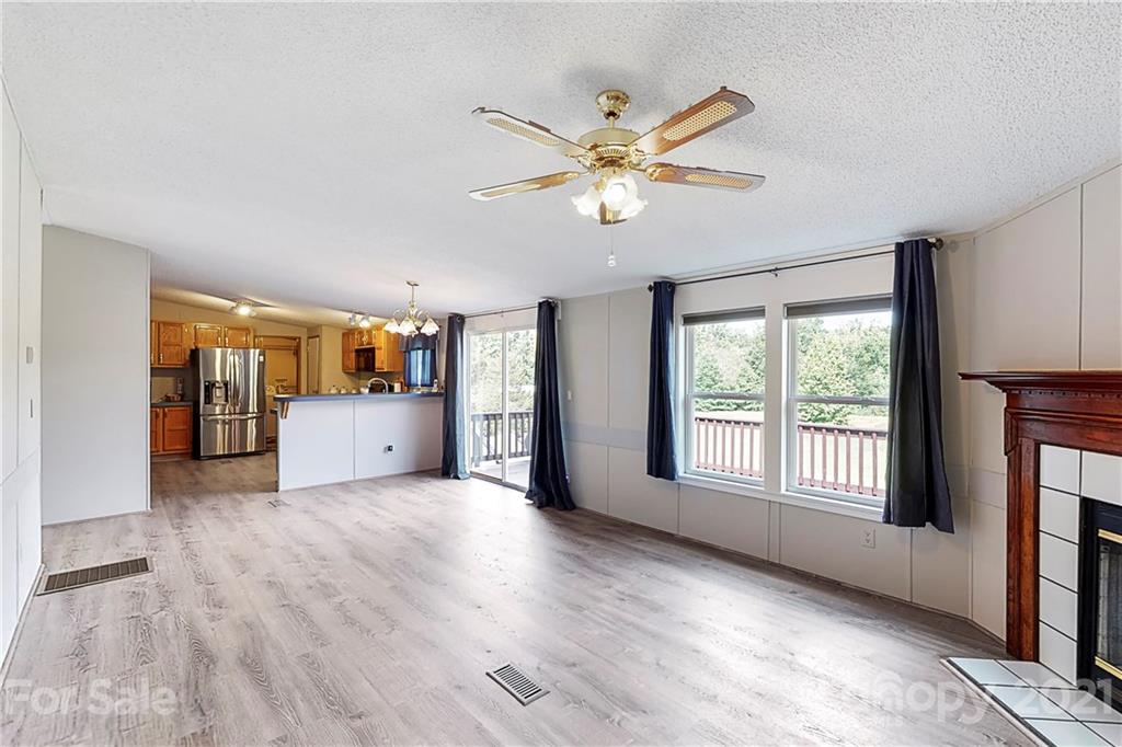 2688 Howells Ferry Road Hickory Grove, SC 29717 - Photo 5 of 43 a view of an empty room with a window and wooden floor
