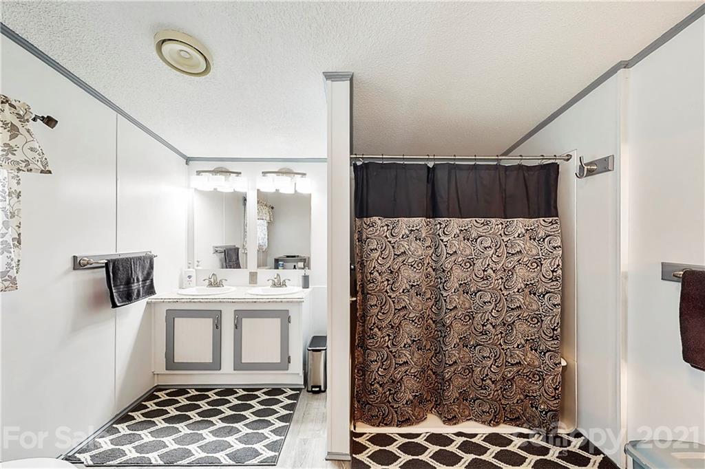 2688 Howells Ferry Road Hickory Grove, SC 29717 - Photo 6 of 43 a bathroom with a shower and a sink