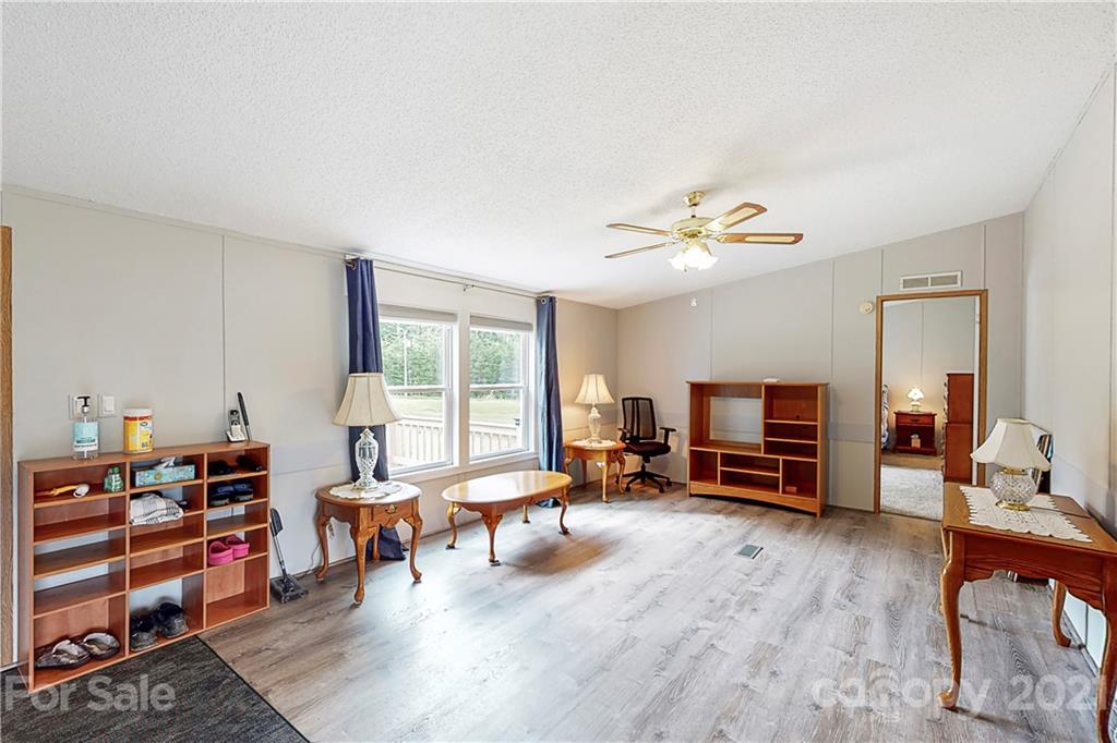 2688 Howells Ferry Road Hickory Grove, SC 29717 - Photo 8 of 43 a living room with furniture and wooden floor