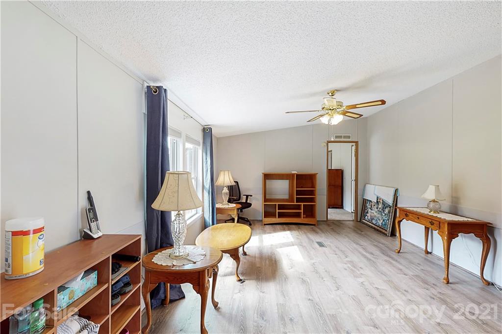 2688 Howells Ferry Road Hickory Grove, SC 29717 - Photo 9 of 43 a living room with furniture and a wooden floor