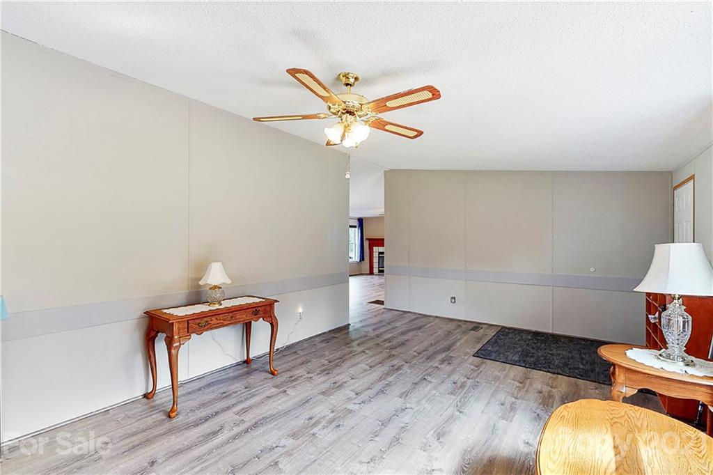 2688 Howells Ferry Road Hickory Grove, SC 29717 - Photo 10 of 43 a view of room with wooden floor and ceiling fan