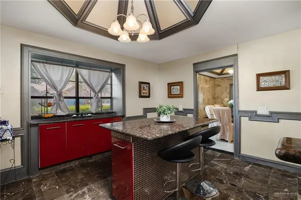 a dining room with a table and chairs