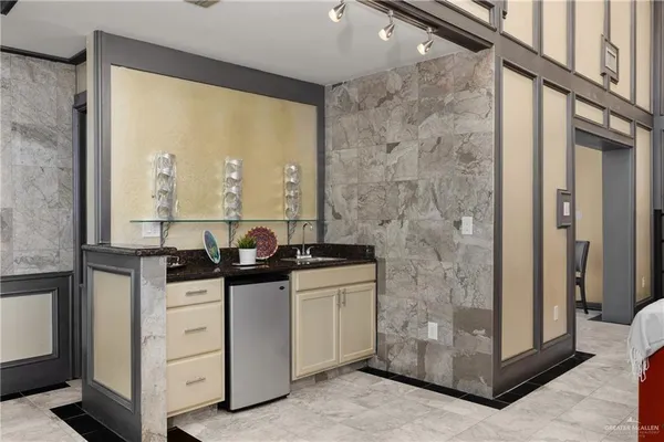 a kitchen with stainless steel appliances granite countertop a stove and a refrigerator