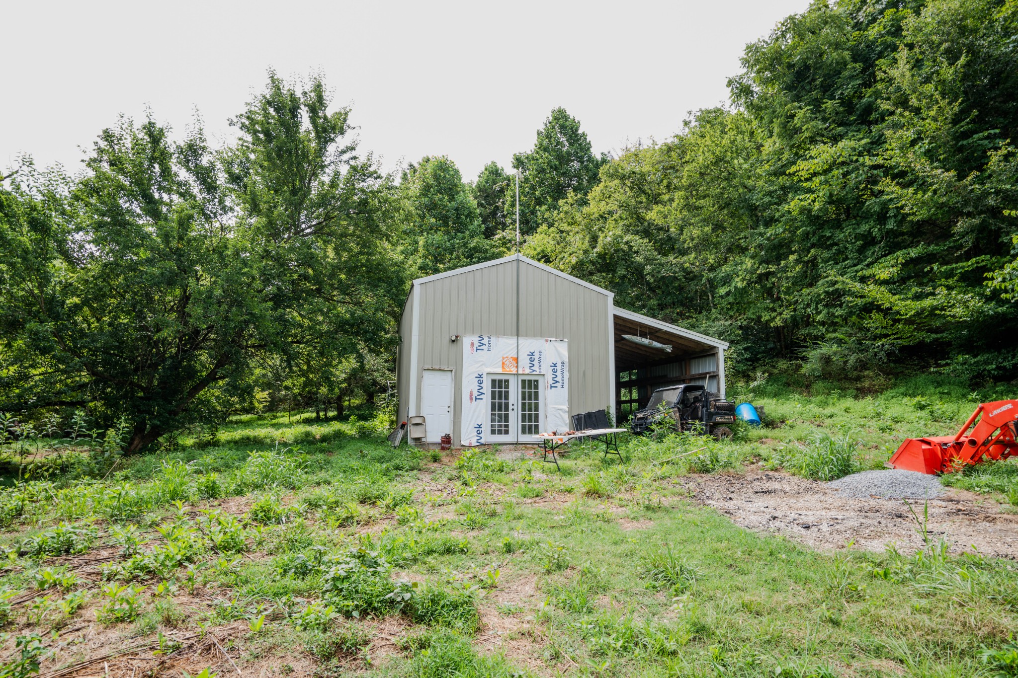 3264 Martin Hollow Road Culleoka, TN 38451 - Photo 37 of 68 a backyard of a house with lots of green space and fountain